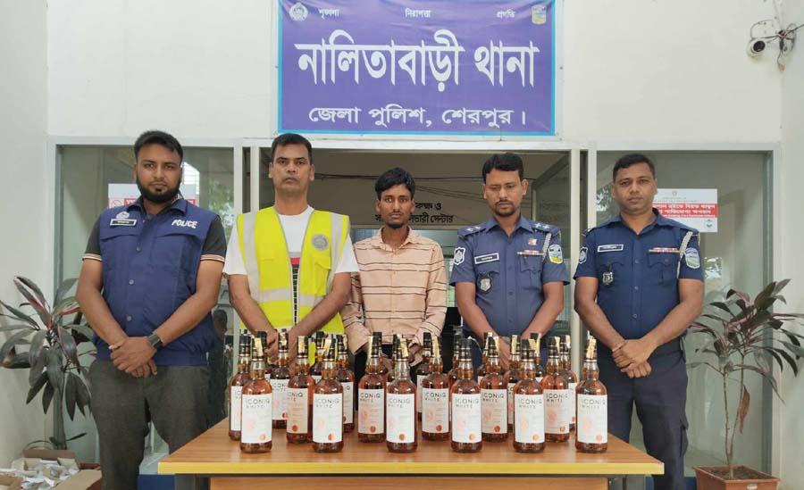 নালিতাবাড়ীতে ২৪ বোতল ভারতীয় মদসহ মাদক ব্যবসায়ী গ্রেফতার